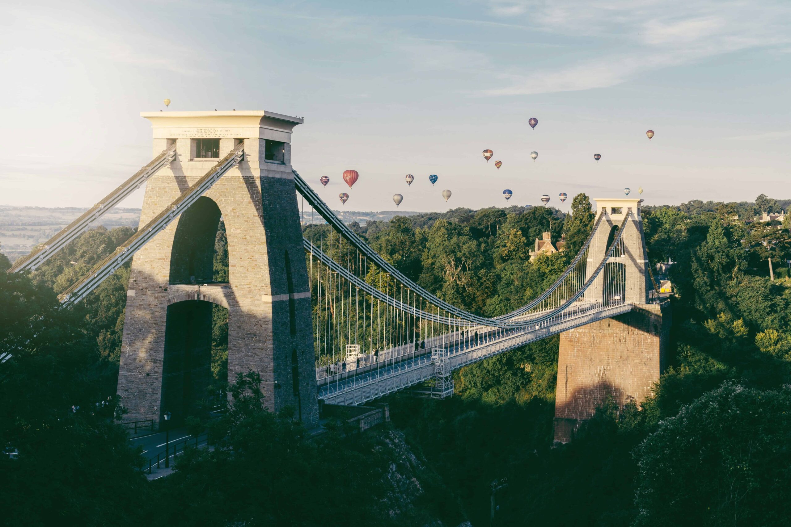 bristol bridge with air balloons in the sky